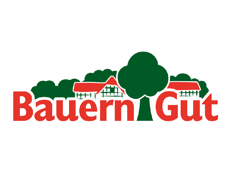 Logo von BauernGut mit roter Schrift, grünen Bäumen und einem Bauernhof.
